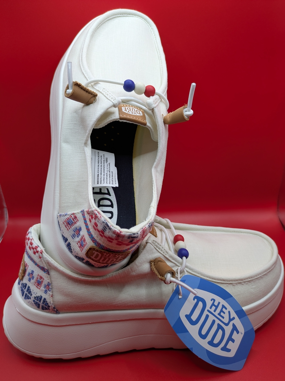 Hey Dude Women's Cream Canvas Slip-On Shoes with Red & Blue Accents